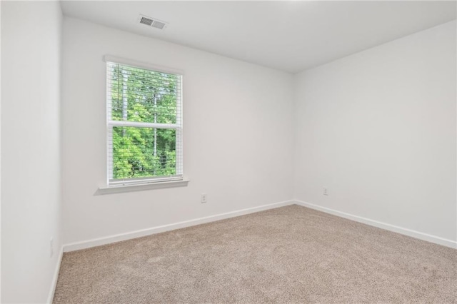 empty room featuring carpet flooring