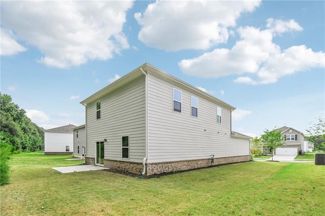 back of house with a patio area, a yard, and central AC unit