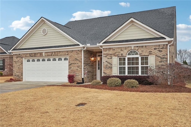 view of front facade featuring a front yard and a garage