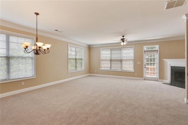 5060 Windcrest Ln, Alpharetta, GA 30022 - unfurnished living room featuring crown molding, light colored carpet, a ceiling fan, plenty of natural light, and a chandelier