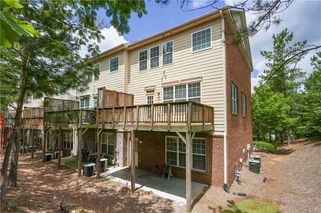 5060 Windcrest Ln, Alpharetta, GA 30022 - back of house with brick siding, a deck, and a patio area