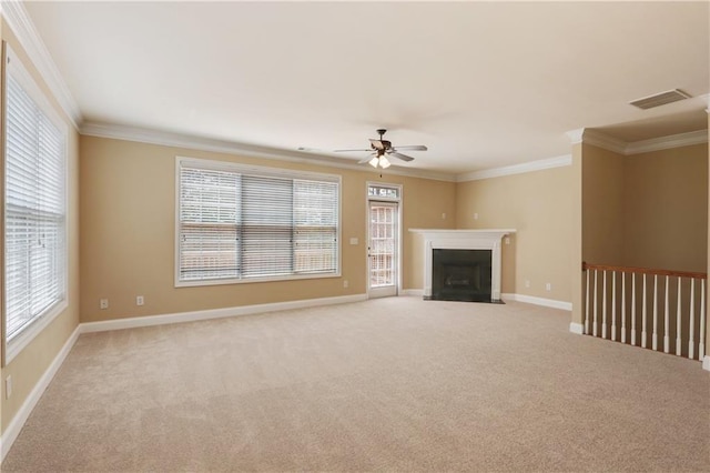 5060 Windcrest Ln, Alpharetta, GA 30022 - unfurnished living room featuring ornamental molding, ceiling fan, carpet, plenty of natural light, and a fireplace with flush hearth