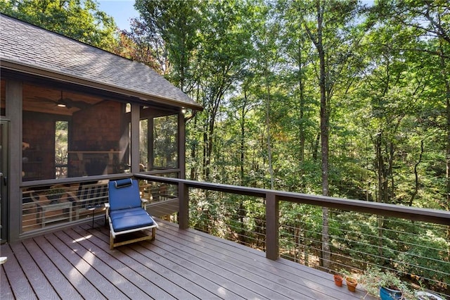 wooden deck with a sunroom