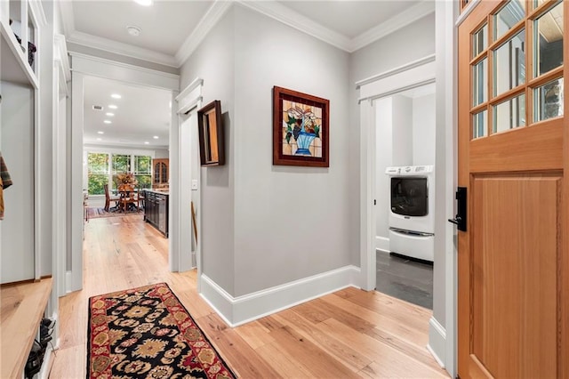 hallway featuring ornamental molding and light wood-type flooring