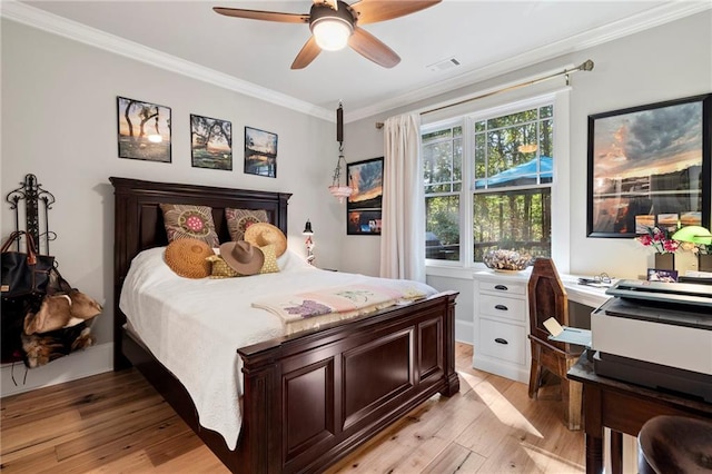 bedroom with ornamental molding, light hardwood / wood-style flooring, and ceiling fan