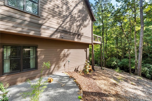 view of side of property with a patio area