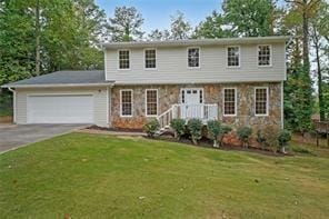 view of front facade featuring a front yard and a garage