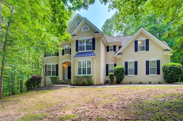 245 Ashley Forest Dr, Fayetteville, GA 30214 - view of front of house featuring an attached garage, driveway, a shingled roof, and stucco siding