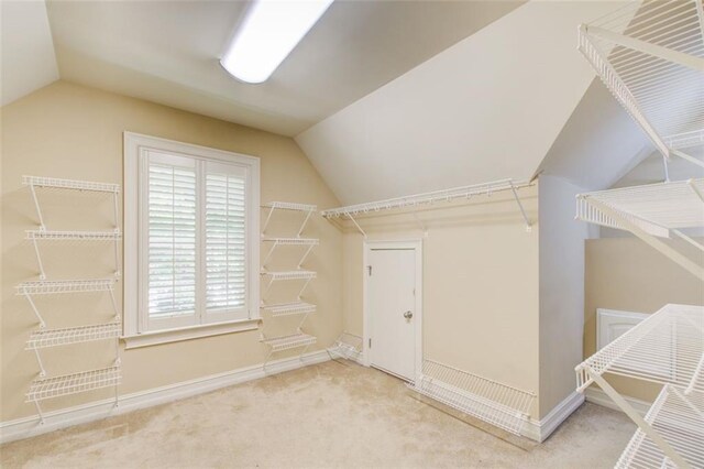 245 Ashley Forest Dr, Fayetteville, GA 30214 - kitchen with premium range hood, a chandelier, dishwashing machine, arched walkways, and decorative backsplash
