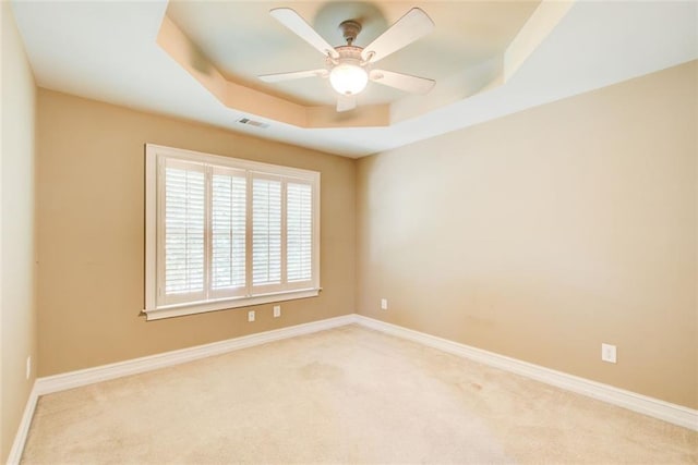 245 Ashley Forest Dr, Fayetteville, GA 30214 - unfurnished room with a raised ceiling, carpet flooring, a ceiling fan, and baseboards