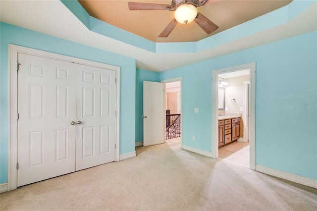 245 Ashley Forest Dr, Fayetteville, GA 30214 - unfurnished bedroom featuring light carpet, a raised ceiling, a closet, and baseboards