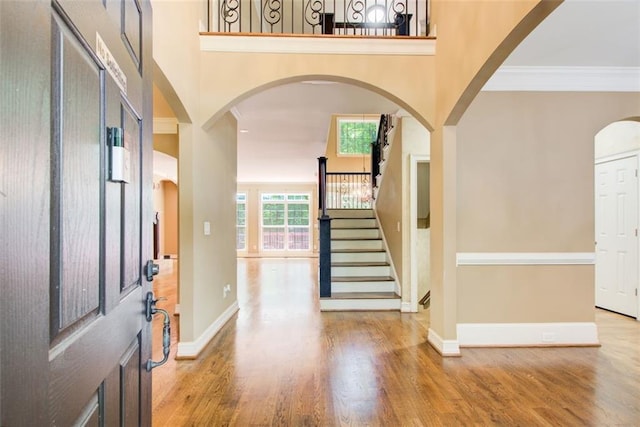 245 Ashley Forest Dr, Fayetteville, GA 30214 - foyer with stairway, wood finished floors, a towering ceiling, baseboards, and ornamental molding