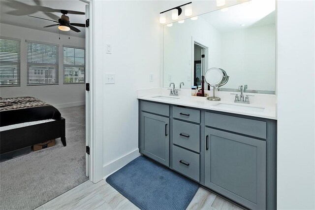1433 Halpern Ln, Kennesaw, GA 30144 - bathroom featuring double vanity, a sink, baseboards, and ceiling fan