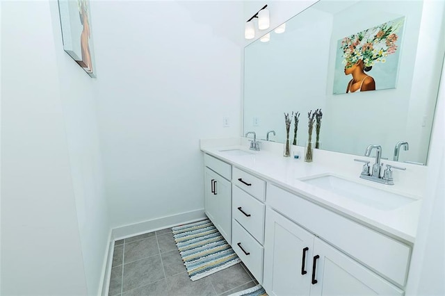 1433 Halpern Ln, Kennesaw, GA 30144 - bathroom featuring baseboards, double vanity, a sink, and tile patterned flooring