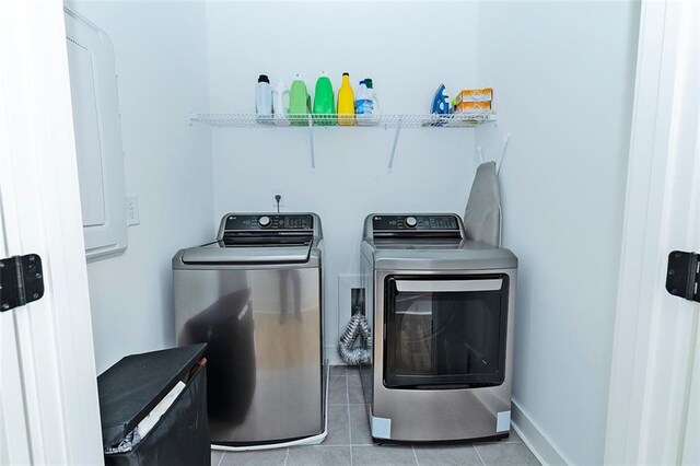 1433 Halpern Ln, Kennesaw, GA 30144 - clothes washing area featuring independent washer and dryer, light tile patterned floors, baseboards, and laundry area