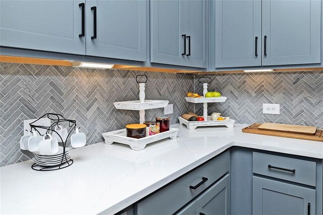 1433 Halpern Ln, Kennesaw, GA 30144 - kitchen featuring gray cabinets, decorative backsplash, and blue cabinetry