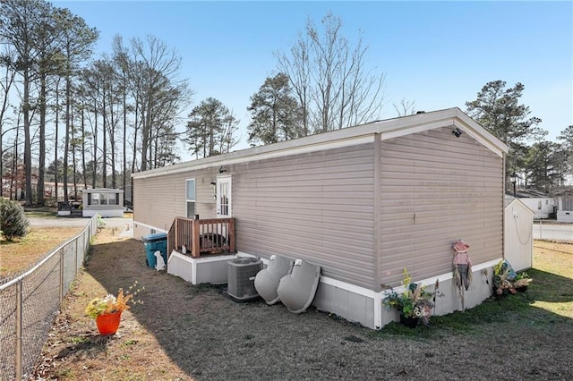 rear view of property featuring central air condition unit