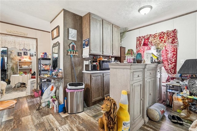 kitchen with hardwood / wood-style flooring and a textured ceiling