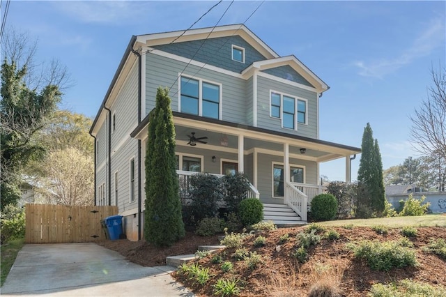 craftsman inspired home with covered porch and fence