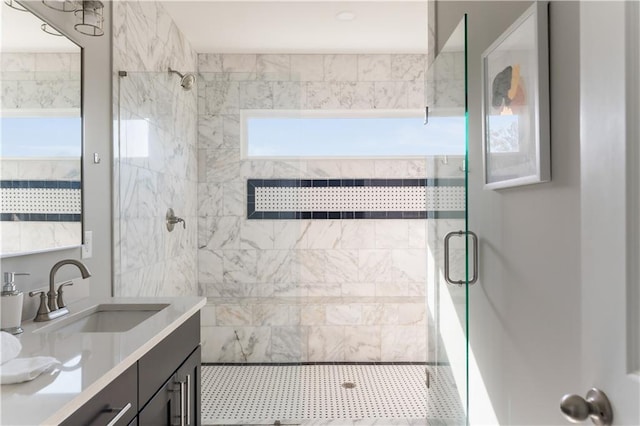 bathroom featuring vanity and a shower stall