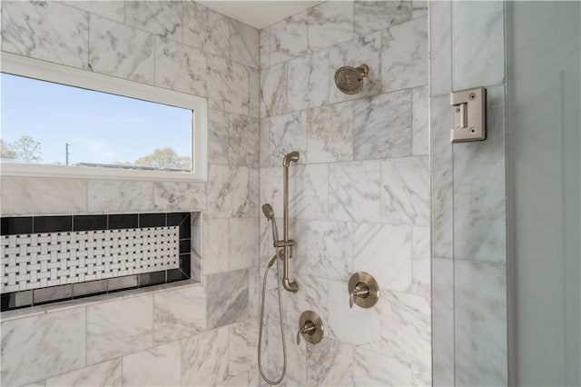 full bathroom with a tile shower