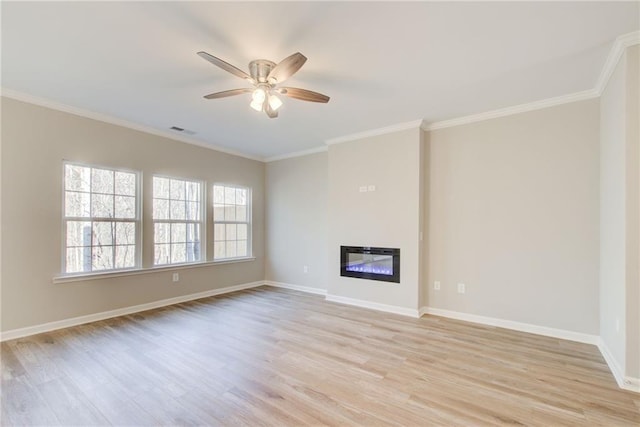 93 Portico Pl, Newnan, GA 30265 - unfurnished living room featuring light wood-type flooring, ceiling fan, ornamental molding, and a glass covered fireplace