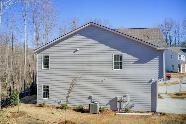 93 Portico Pl, Newnan, GA 30265 - view of property exterior featuring a central AC unit and a shingled roof