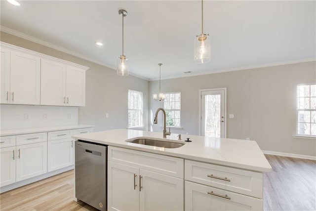 93 Portico Pl, Newnan, GA 30265 - kitchen with stainless steel dishwasher, light wood finished floors, white cabinetry, a center island with sink, and crown molding