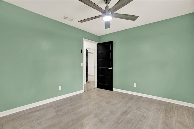 215 Maplewood Dr SW, Calhoun, GA 30701 - unfurnished room with ceiling fan, baseboards, and wood finished floors