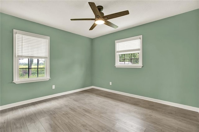 215 Maplewood Dr SW, Calhoun, GA 30701 - unfurnished room featuring ceiling fan, baseboards, and wood finished floors
