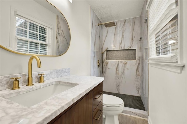 215 Maplewood Dr SW, Calhoun, GA 30701 - full bathroom featuring a marble finish shower, toilet, vanity, and healthy amount of natural light