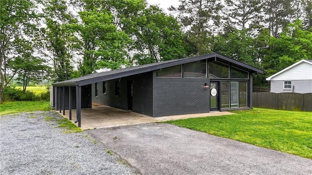 215 Maplewood Dr SW, Calhoun, GA 30701 - view of outdoor structure with asphalt driveway and a carport