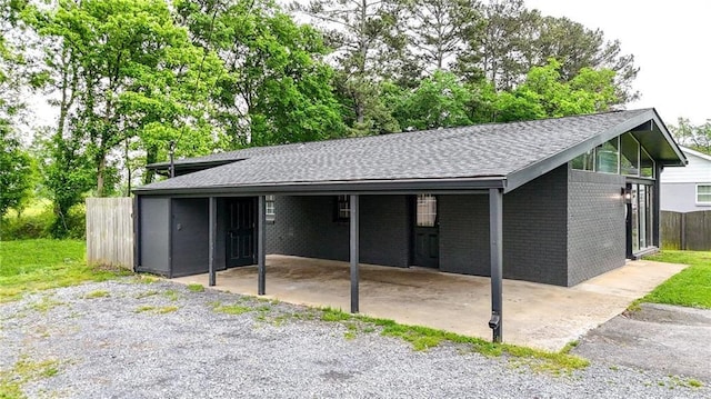 215 Maplewood Dr SW, Calhoun, GA 30701 - garage featuring a carport