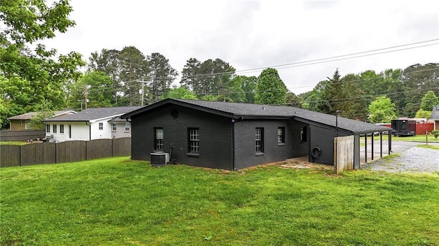 215 Maplewood Dr SW, Calhoun, GA 30701 - back of property featuring brick siding and central AC unit