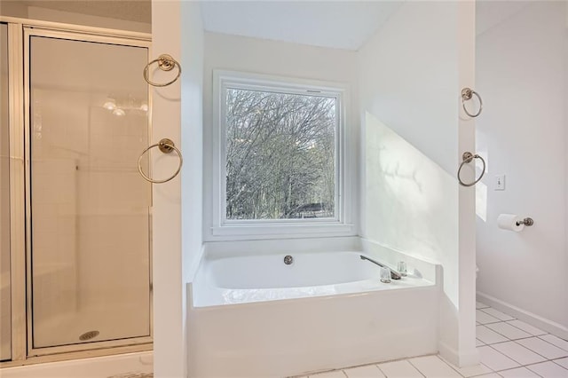 bathroom with tile patterned flooring and plus walk in shower