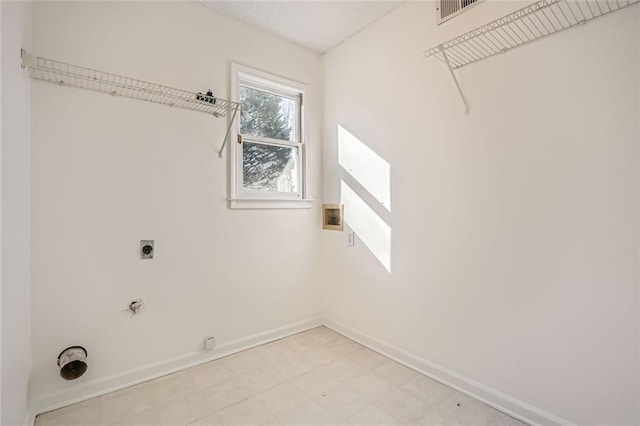 clothes washing area featuring hookup for a washing machine, gas dryer hookup, and hookup for an electric dryer