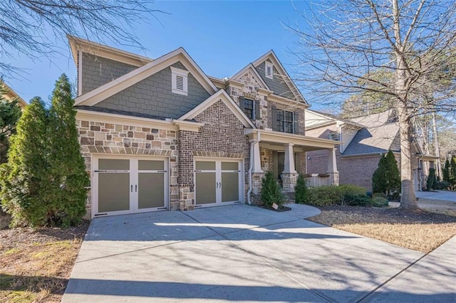 craftsman house featuring a garage and covered porch