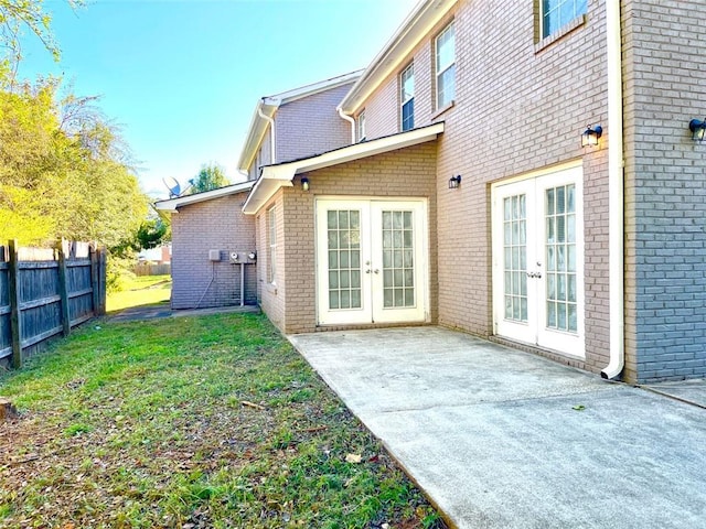 2124 Hickory Bnd SE, Conyers, GA 30013 - back of property with french doors, a patio, and brick siding