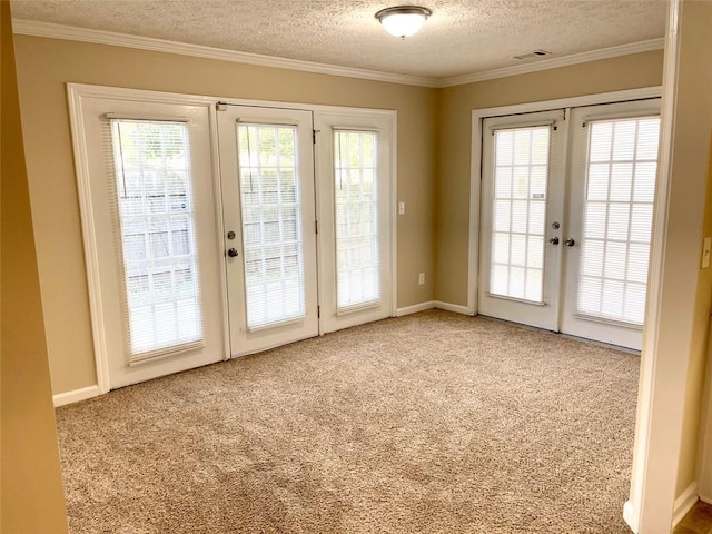 2124 Hickory Bnd SE, Conyers, GA 30013 - doorway with french doors, a textured ceiling, healthy amount of natural light, carpet, and ornamental molding