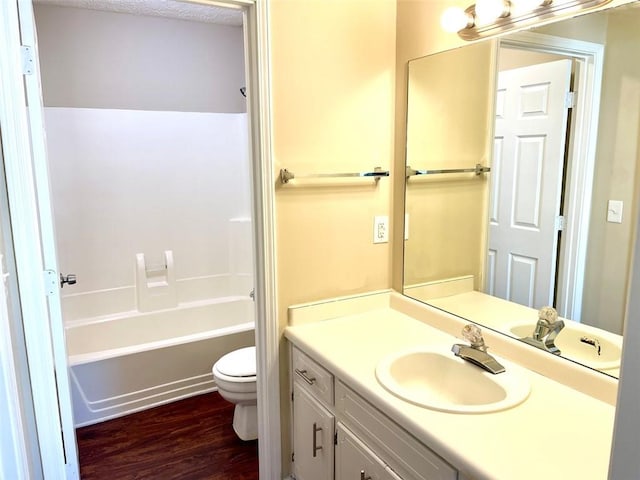 2124 Hickory Bnd SE, Conyers, GA 30013 - bathroom featuring vanity, wood finished floors, and  shower combination