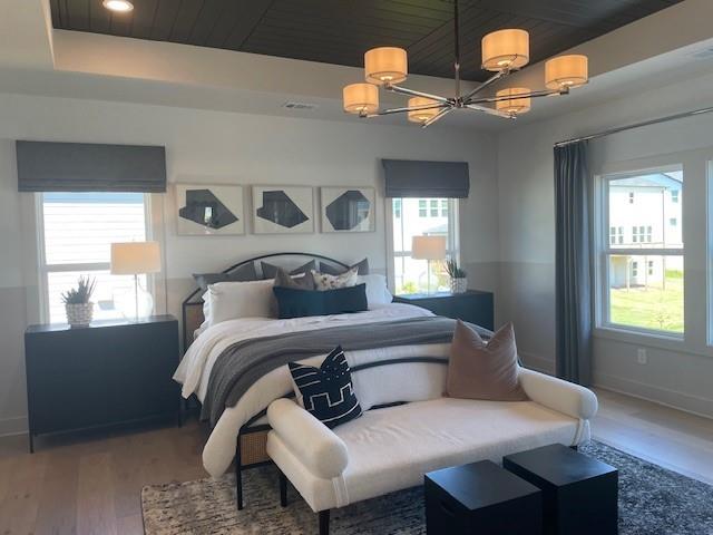 750 Keystone Dr, Woodstock, GA 30188 - bedroom featuring a chandelier, wood finished floors, baseboards, and recessed lighting