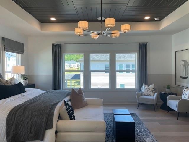 750 Keystone Dr, Woodstock, GA 30188 - bedroom with a tray ceiling, a chandelier, wood ceiling, and wood finished floors