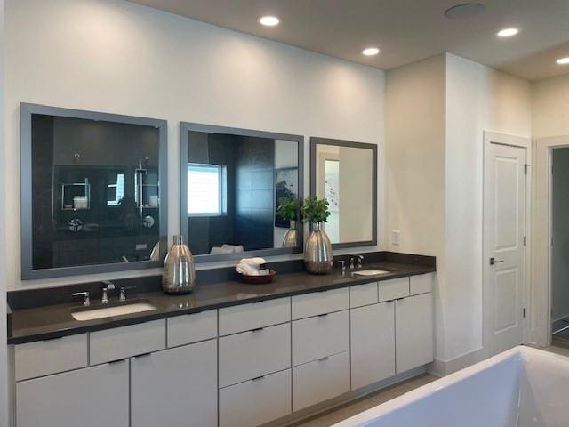 750 Keystone Dr, Woodstock, GA 30188 - full bath featuring double vanity, recessed lighting, and a bath