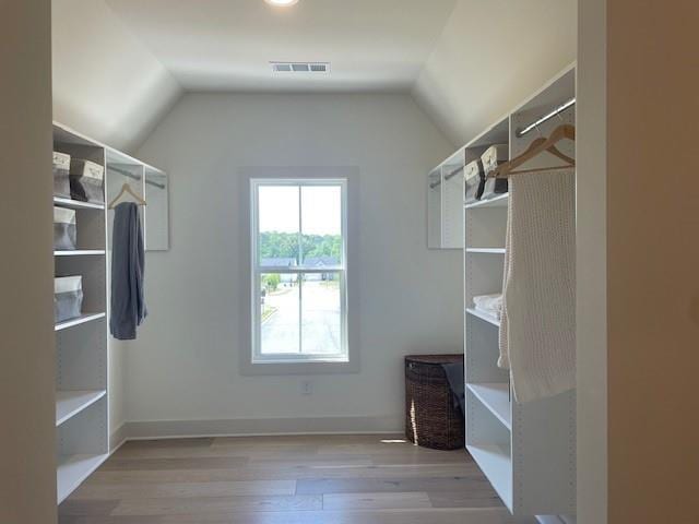 750 Keystone Dr, Woodstock, GA 30188 - walk in closet featuring wood finished floors and lofted ceiling