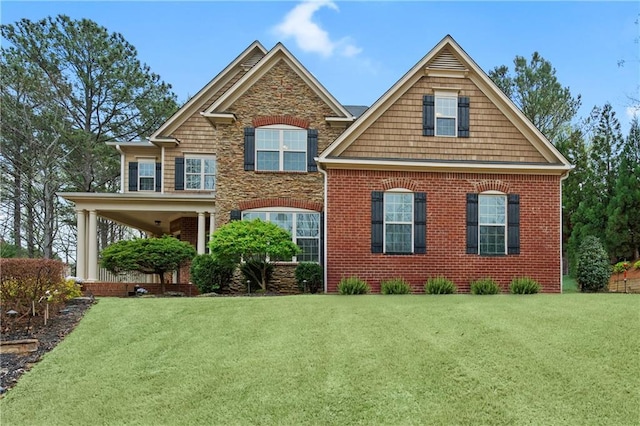 view of front facade featuring a front lawn and brick siding