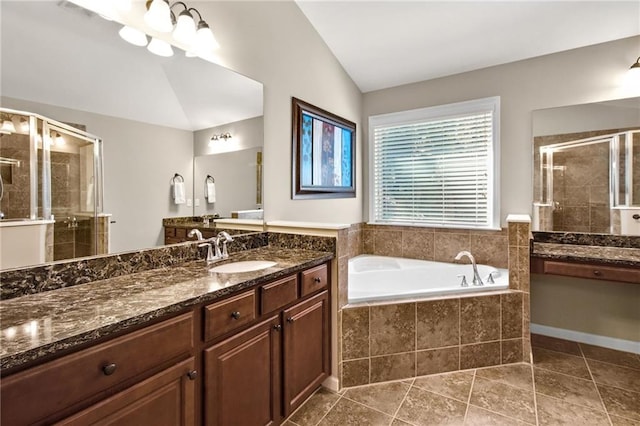 full bath featuring visible vents, vanity, vaulted ceiling, a bath, and a stall shower