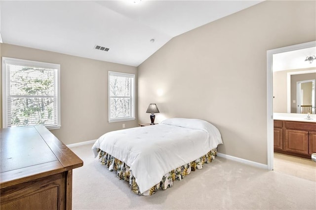 bedroom featuring lofted ceiling, visible vents, light carpet, and baseboards