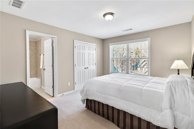 bedroom with baseboards, a closet, visible vents, and light colored carpet