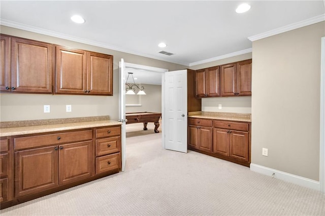 kitchen featuring recessed lighting, light colored carpet, visible vents, ornamental molding, and brown cabinets