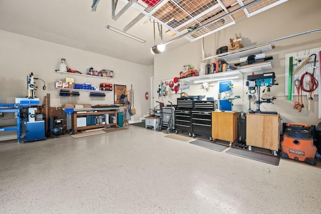 garage with a workshop area